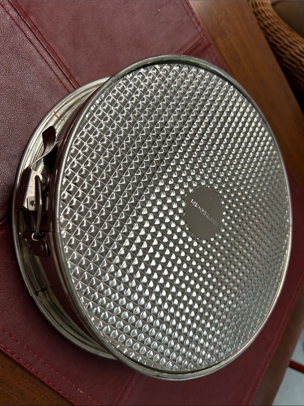 Springform pan (cheesecakes?)Textured Metal Baking Pan - Silver, 9.5” diameter.